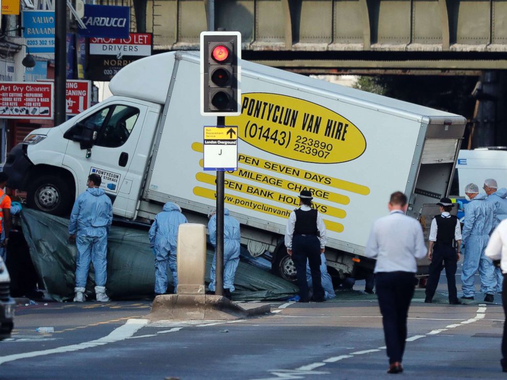 PHOTO: Forensic officers move the van at Finsbury Park in north London, where a vehicle struck pedestrians in north London, June 19, 2017.