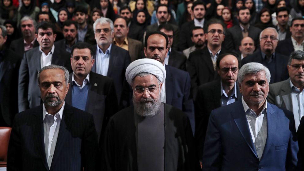 PHOTO: In this photo released by official website of the office of the Iranian Presidency, President Hassan Rouhani, center, listens to the national anthem at the start of a ceremony marking Student Day at Tehran University in Tehran, Iran, Dec. 6, 2016.