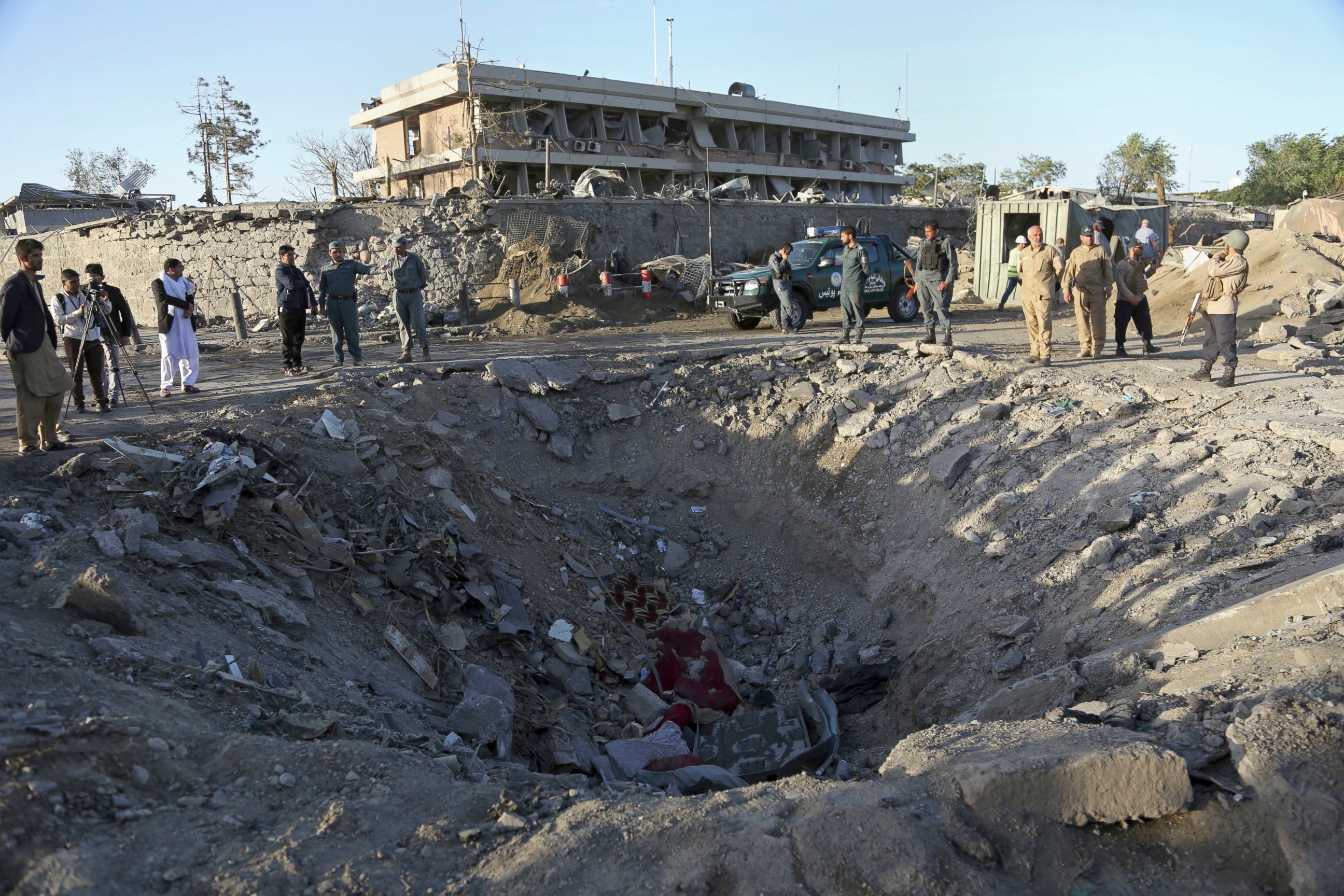 PHOTO: Security forces stand next to a crater created by massive explosion in front of the German Embassy in Kabul, Afghanistan, May 31, 2017. 