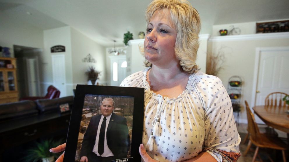 Laurie Holt holds a photograph of her son Joshua Holt at her home, in Riverton, Utah in this July 13, 2016 file photo. 