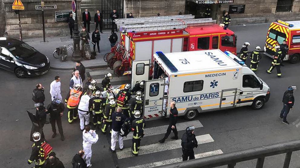 PHOTO: In this photo provided by Sheng Zihao, an unidentified wounded person is taken into an ambulance in Paris, Feb. 3, 2017. 