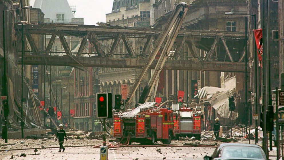 PHOTO: Firemen walk amid debris at the scene of a bomb blast in central Manchester, 180 miles north of London, June 15, 1996.