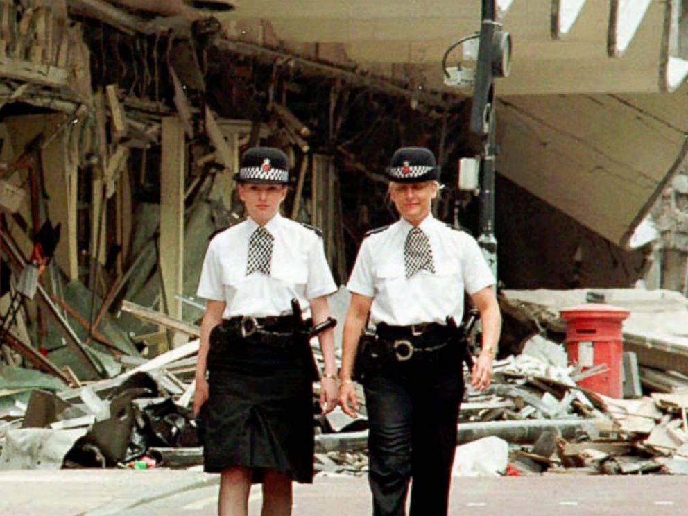 PHOTO: Manchester Police Officers Vanessa Winstanley and Wendy McCormick patrol outside the destroyed Marks and Spencers building in central Manchester, England,June 18, 1996.