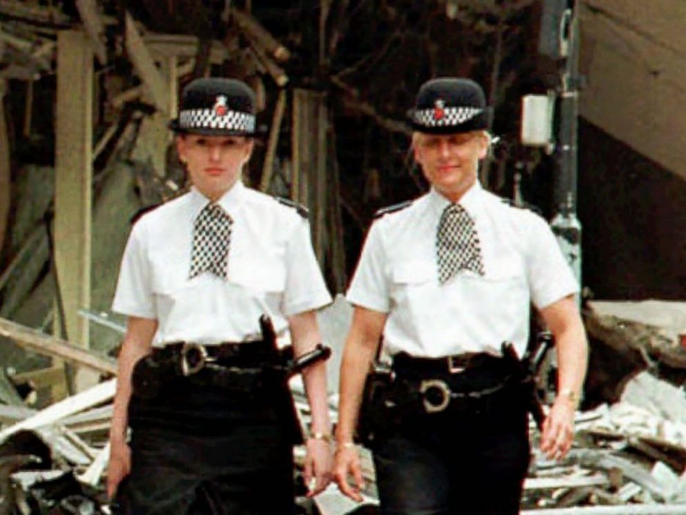 PHOTO: Manchester Police Officers Vanessa Winstanley and Wendy McCormick patrol outside the destroyed Marks and Spencers building in central Manchester, England,June 18, 1996. 