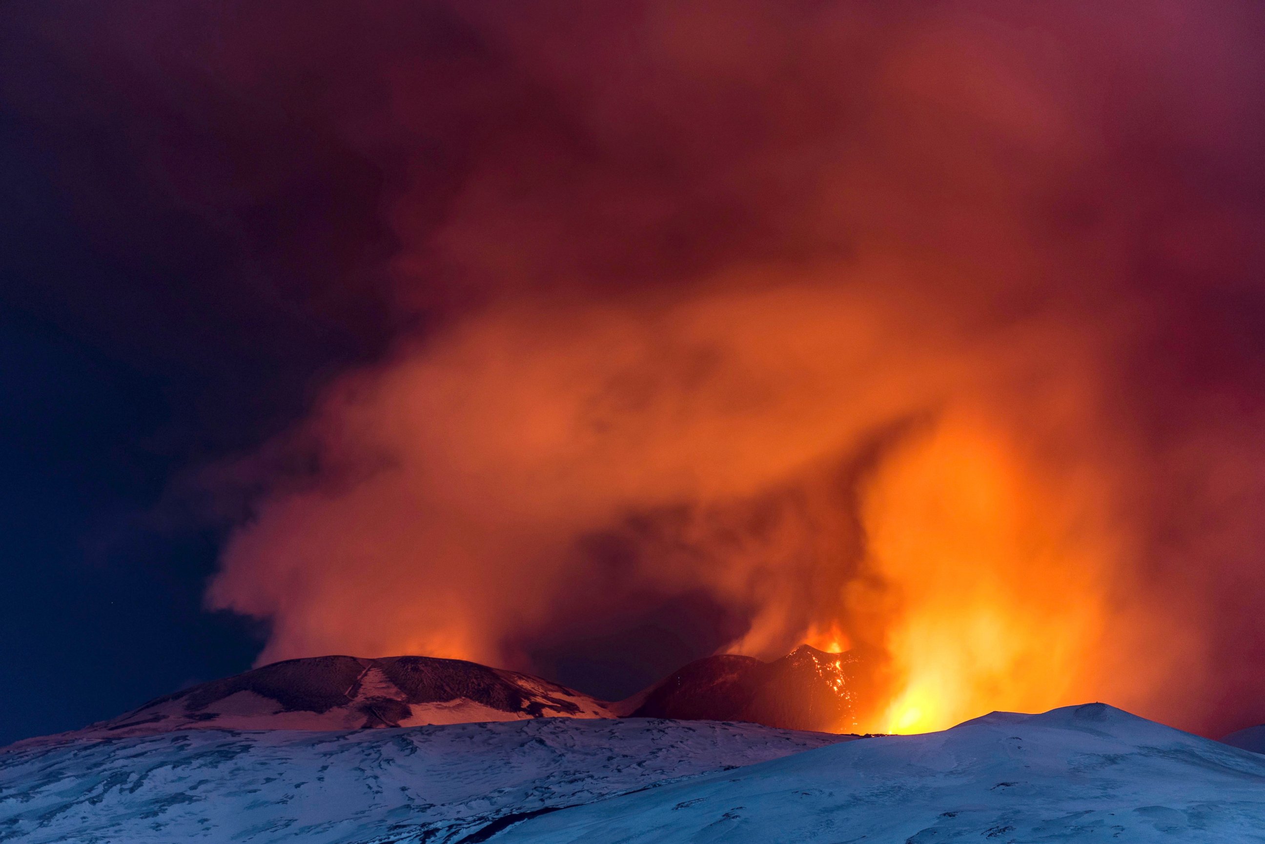 PHOTO: Snow-covered Mount Etna, Europe's most active volcano, spews lava during an eruption, March 16, 2017. 