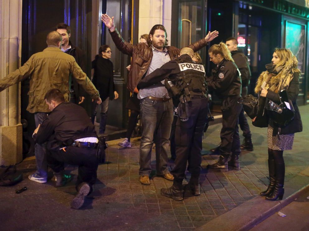PHOTO: Bystanders are frisked by police officers near the Champs Elysees avenue in Paris, after a fatal shooting on April 20, 2017.