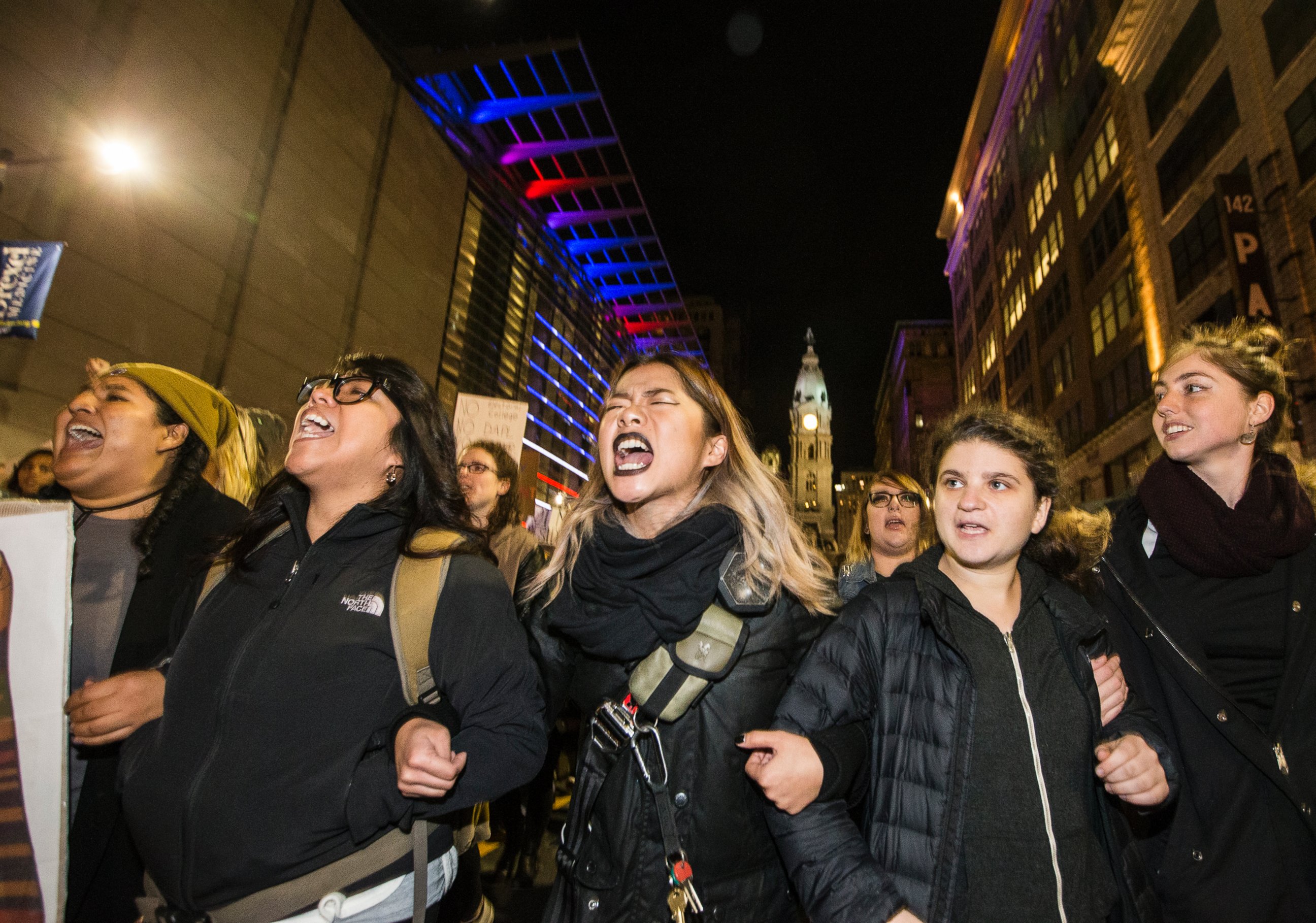 PHOTO: Protesters unhappy with the presidential election march north on Broad St. arm-in-arm, Nov. 10, 2016, in Philadelphia. 