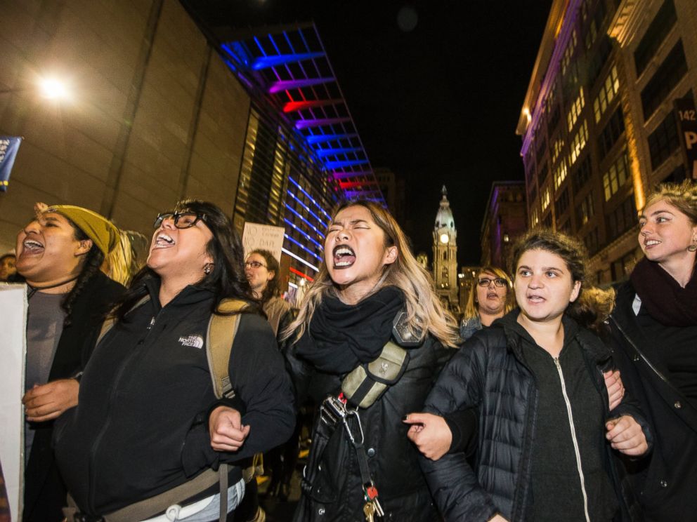 PHOTO: Protesters unhappy with the presidential election march north on Broad St. arm-in-arm, Nov. 10, 2016, in Philadelphia.