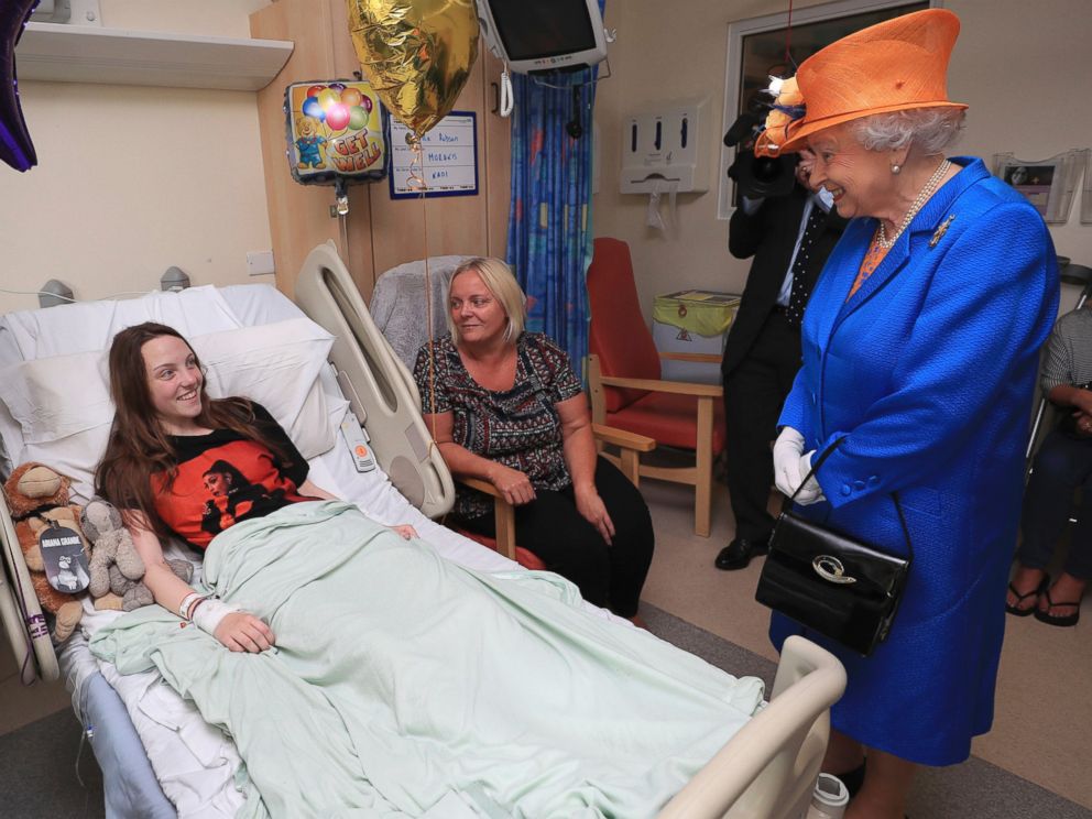 PHOTO: Britain's Queen Elizabeth II. right,  speaks to Millie Robson, 15, and her mother, Marie, as she visits the Royal Manchester Children's Hospital in Manchester England, to meet victims and to thank members of staff who treated them, May 25, 2017.