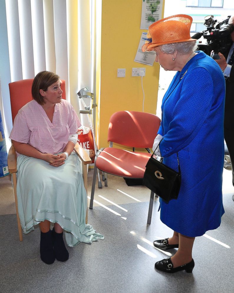 PHOTO: Britain's Queen Elizabeth II, right, speaks to Ruth Murrell during the Queen's visit to the Royal Manchester Children's Hospital in Manchester England, to meet victims, May 25, 2017.