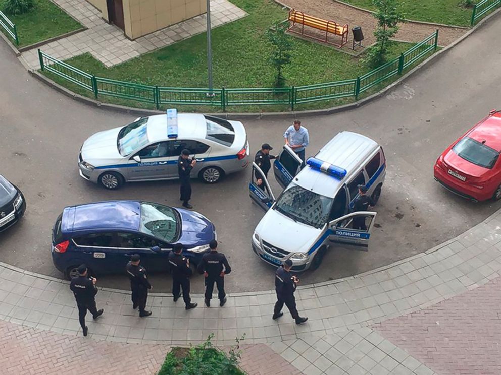 PHOTO: Alexei Navalny, blue shirt, is detained by police outside his apartment in Moscow, June 12, 2017.
<p itemprop=