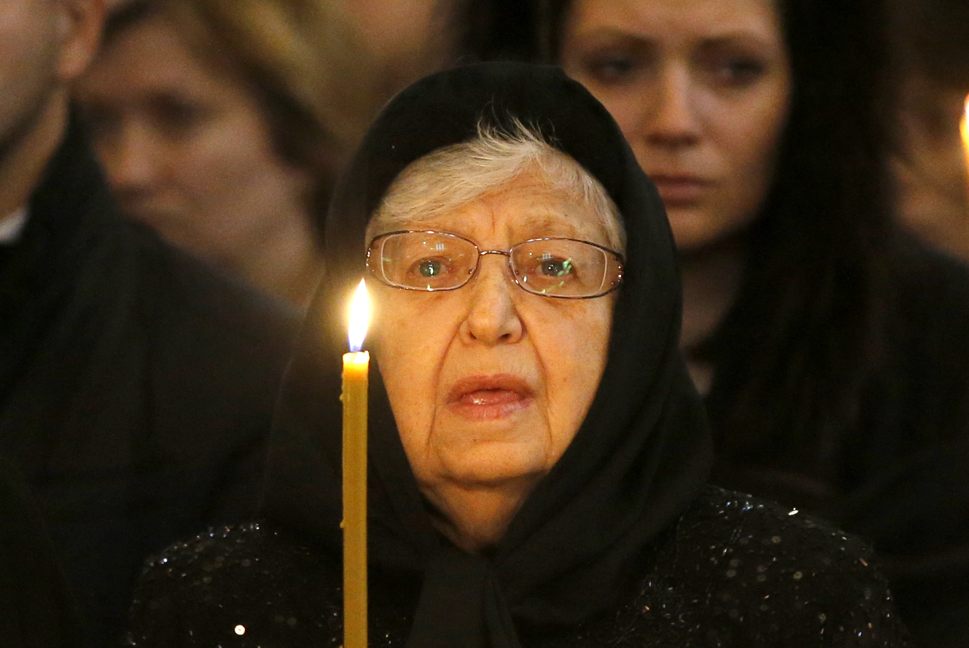 PHOTO: Mother of Andrei Karlov, Maria holds a candle during a religious service for killed Russian ambassador to Turkey, Andrei Karlov inside the Christ the Saviour Cathedral in Moscow, Russia, Dec. 22, 2016. 