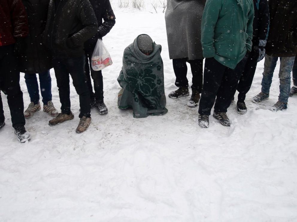 PHOTO: Migrants queue for food in front of an abandoned warehouse in Belgrade, Serbia, Jan. 11, 2017.