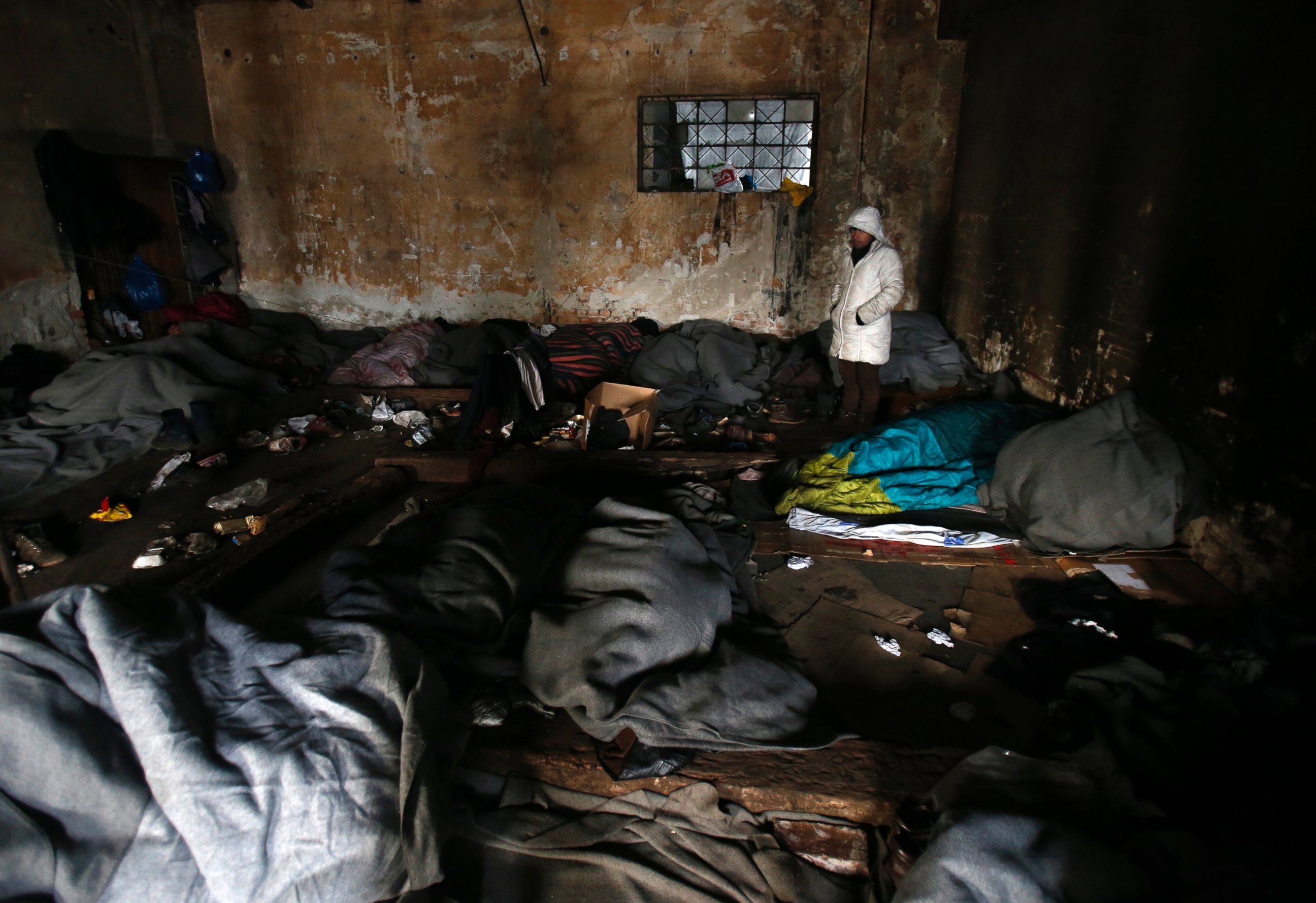 PHOTO: Migrants in sleeping bags rest in an abandoned warehouse in Belgrade, Serbia, Jan. 10, 2017.