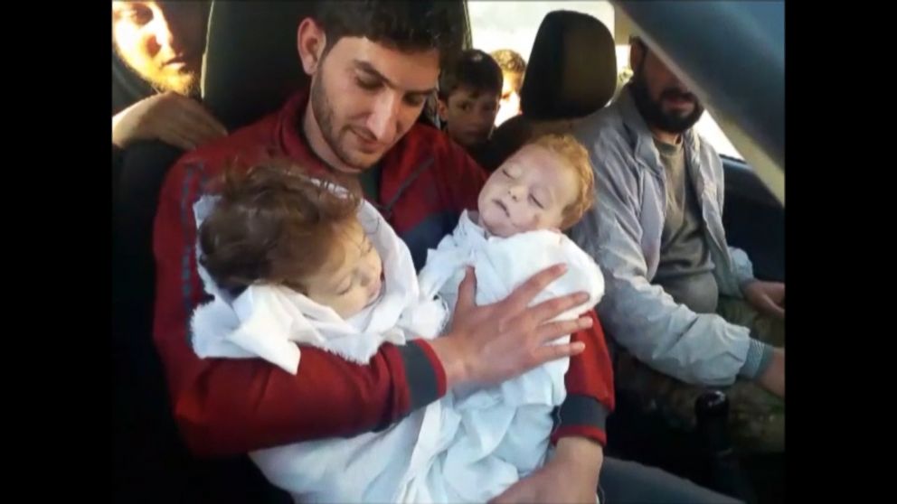 PHOTO: Abdel Hameed al-Youssef cradles the bodies of his nine month old twins after they were killed in a suspected chemical attack on Idlib in Syria on April 4, 2017. 