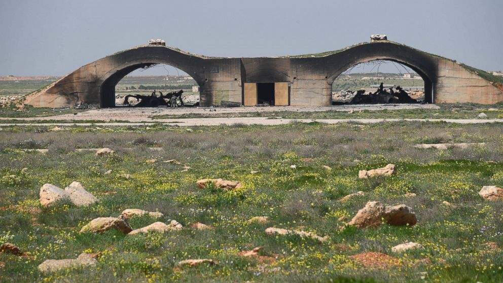 PHOTO: In a photo released by the Russian state-owned news outlet, Sputnik, the remains of two planes are seen underneath a shelter following the U.S. missile attack on an air base in Syria, April 7, 2017.  