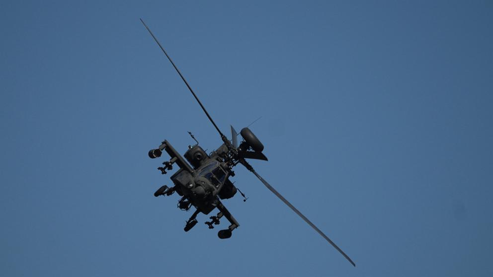 PHOTO: An Apache helicopter flies as soldiers take part in the U.S.-led Immediate Response 25 military exercise in Petrochori, northern Greece Wednesday, June 4, 2025.