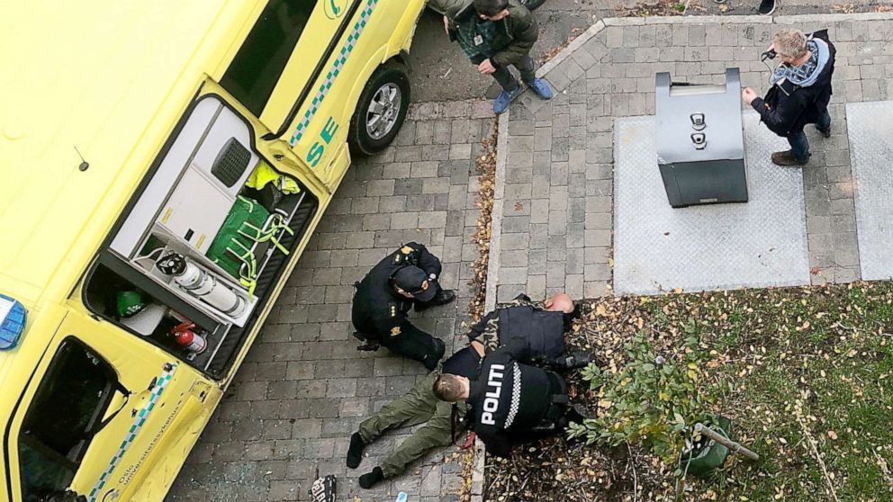 PHOTO: Police detain a man, bottom center laying on the ground, next to a damaged ambulance that he stole after an incident in the center of Oslo, Tuesday, Oct. 22, 2019. (Cathrine Hellesoy, Aftenposten via AP) 