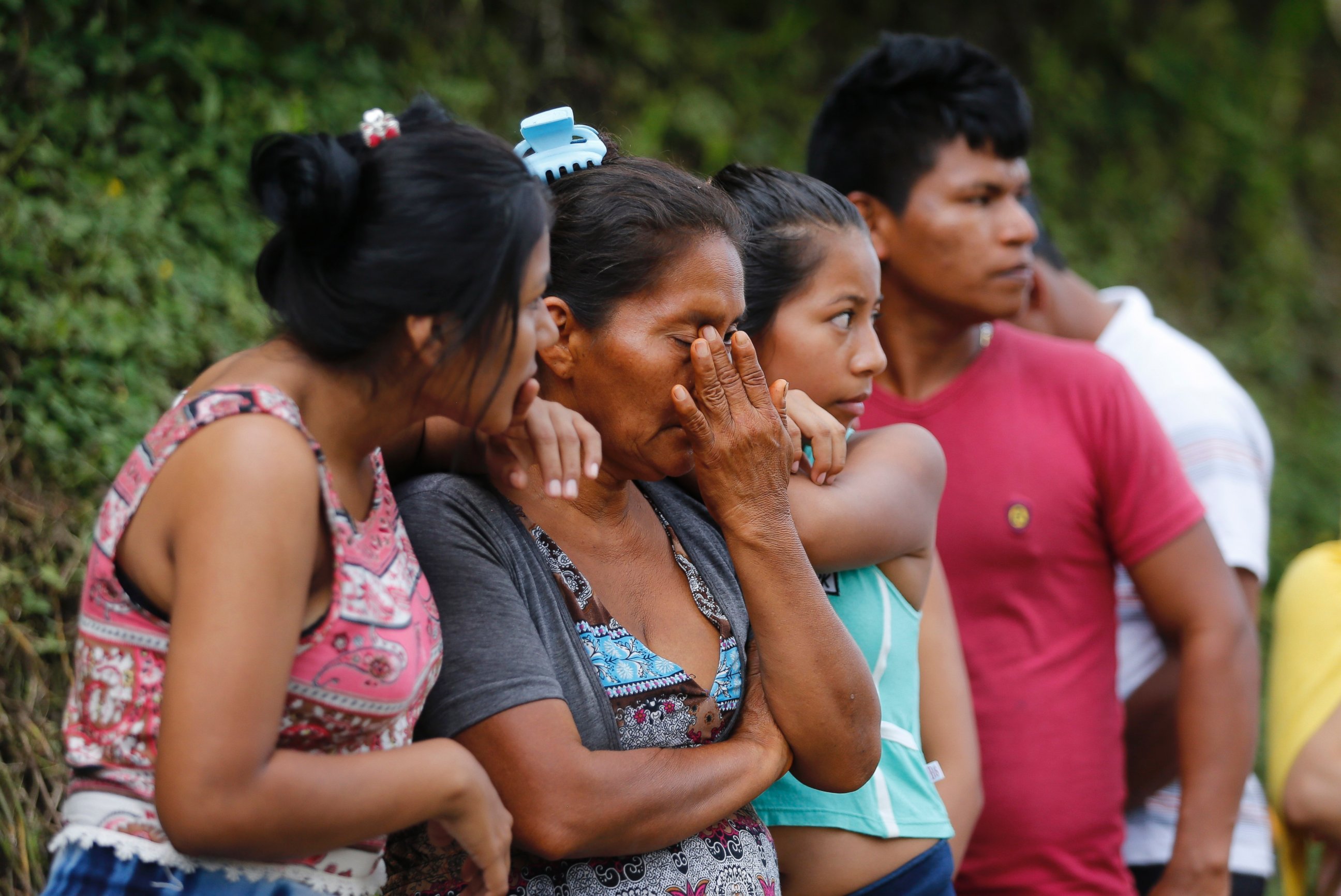 PHOTO: People line up outside a cemetery to looking for their missing relatives in Mocoa, Colombia, Sunday, April 2, 2017.