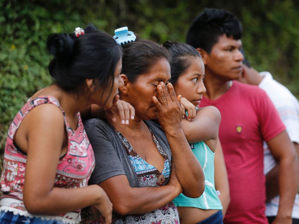 PHOTO: People line up outside a cemetery to looking for their missing relatives in Mocoa, Colombia, Sunday, April 2, 2017.
