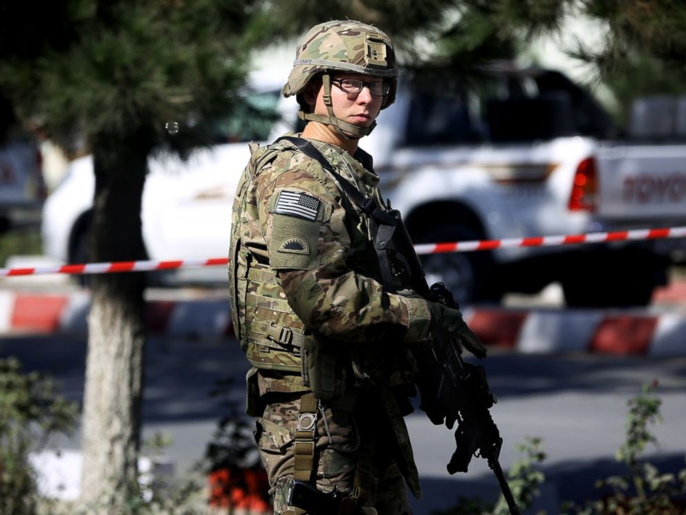 PHOTO: A U.S. military force stands guard at the site of a suicide attack near a U.S. military camp in Kabul, Afghanistan, Sept. 16, 2014.