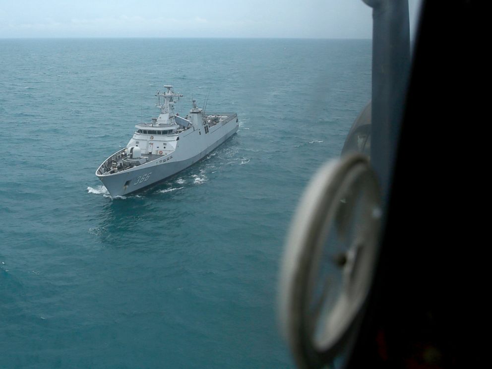 PHOTO: Indonesian Navy ship KRI Sultan Hasanuddin is seen through the window of Air Force Super Puma helicopter during a search operation for the victims of AirAsia Flight 8501 on the Java Sea, Indonesia, Jan. 7, 2015.