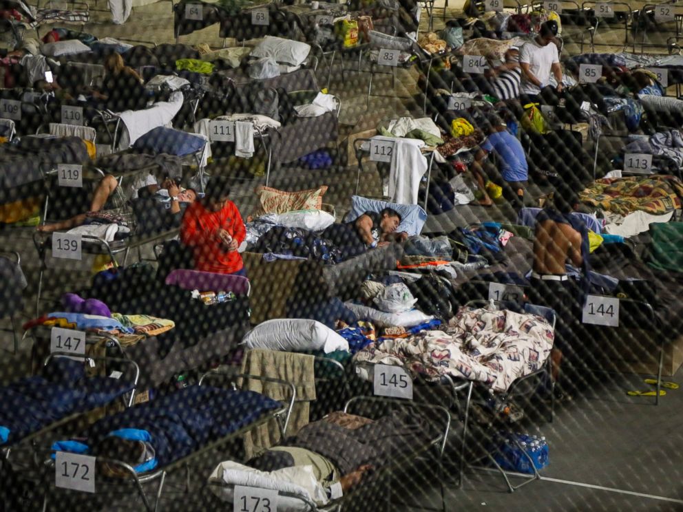 PHOTO: Evacuees from the Fort McMurray wildfires rest on a hockey rink at the evacuation center in Lac la Biche, Alberta, May 5, 2016. The province of Alberta declared a state of emergency.