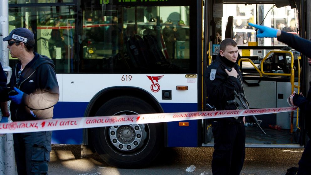 Israeli police officers secure the scene of a stabbing attack in Tel Aviv, Israel, Jan. 21, 2015.