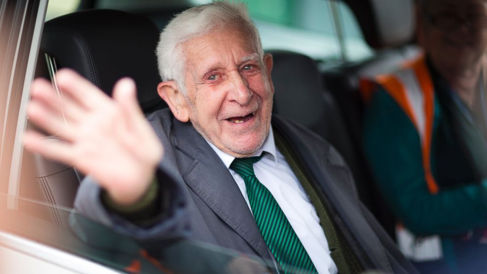 Bernard Jordan, gestures, as he is driven home after returning from Normandy on a Brittany Ferry, in Portsmouth, England, Saturday June 7, 2014. An 89-year old World War II veteran who was reported missing from a nursing home in England was found in Normandy after traveling to attend D-Day commemorations.  Jordan left the home wearing his service medals and joined a group of veterans heading to France by bus. Jordan was last seen at The Pines home in Hove, southern England, on Thursday morning. Staff called police when he did not return that evening.