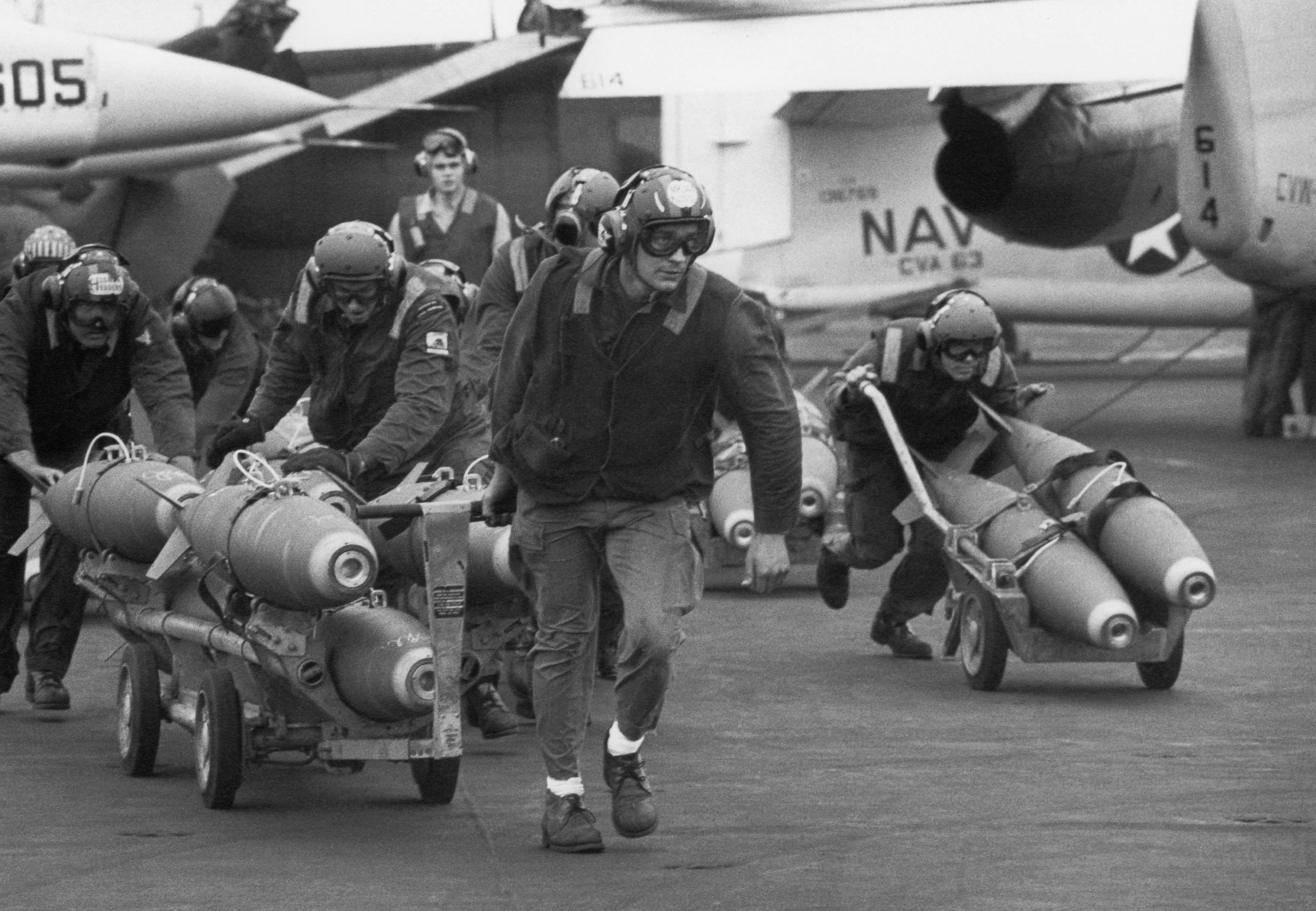 PHOTO: U.S. Navy armorers wheel out 500-pound bombs for the wing racks of jets being used in support for South Vietnamese troops fighting the enemy in Laos, on March 18, 1971. 