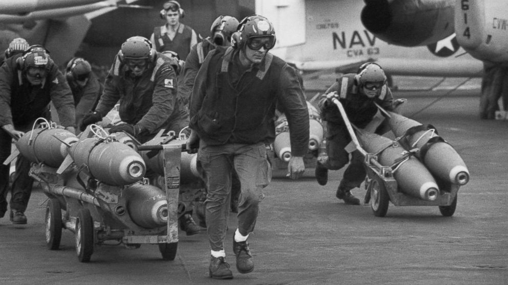 PHOTO: U.S. Navy armorers wheel out 500-pound bombs for the wing racks of jets being used in support for South Vietnamese troops fighting the enemy in Laos, on March 18, 1971.