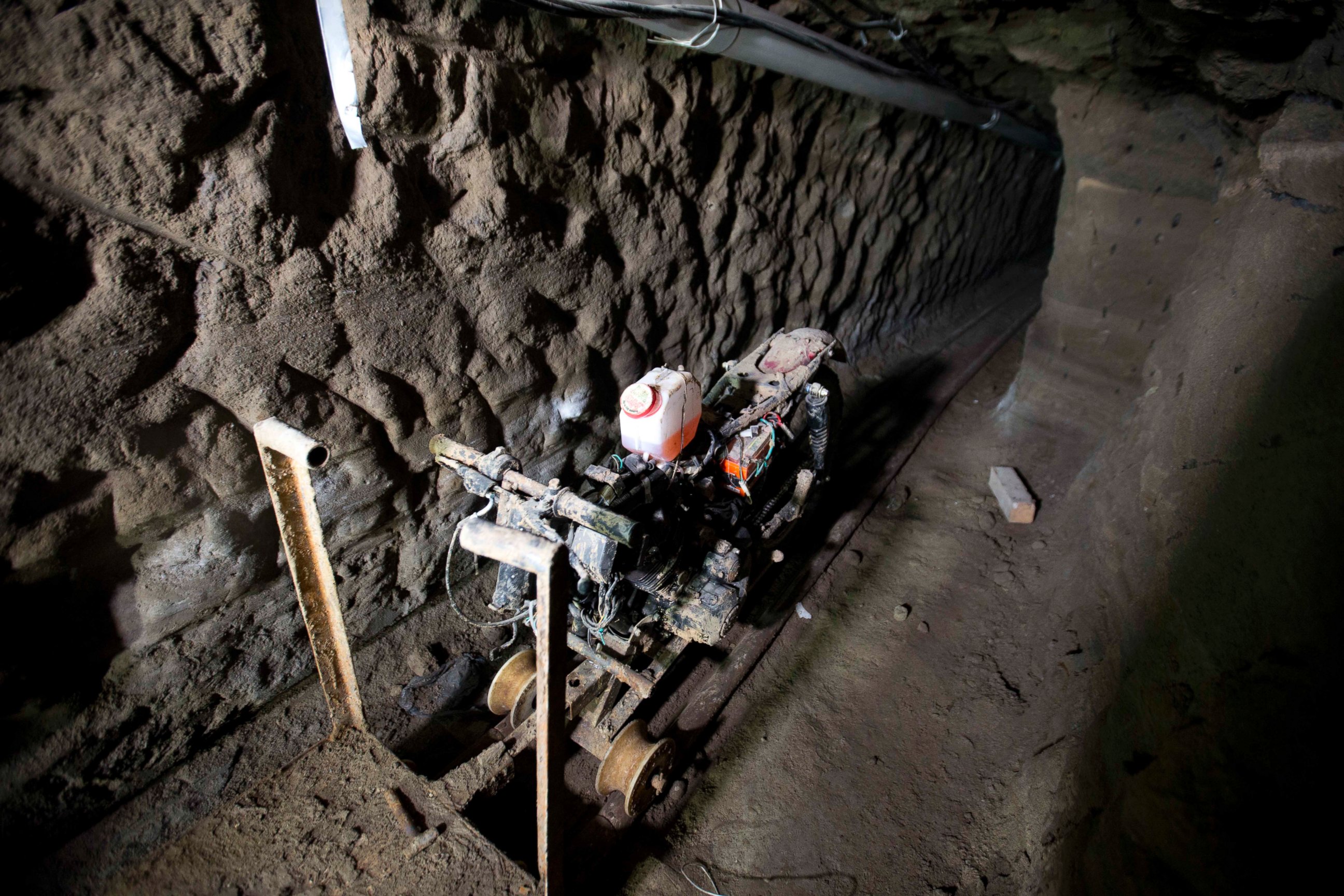 PHOTO: A motorcycle adapted to a rail sits in the tunnel under the half-built house where according to authorities, drug lord Joaquin "El Chapo" Guzman made his escape from the Altiplano maximum security prison in Almoloya, Mexico, July 14, 2015.