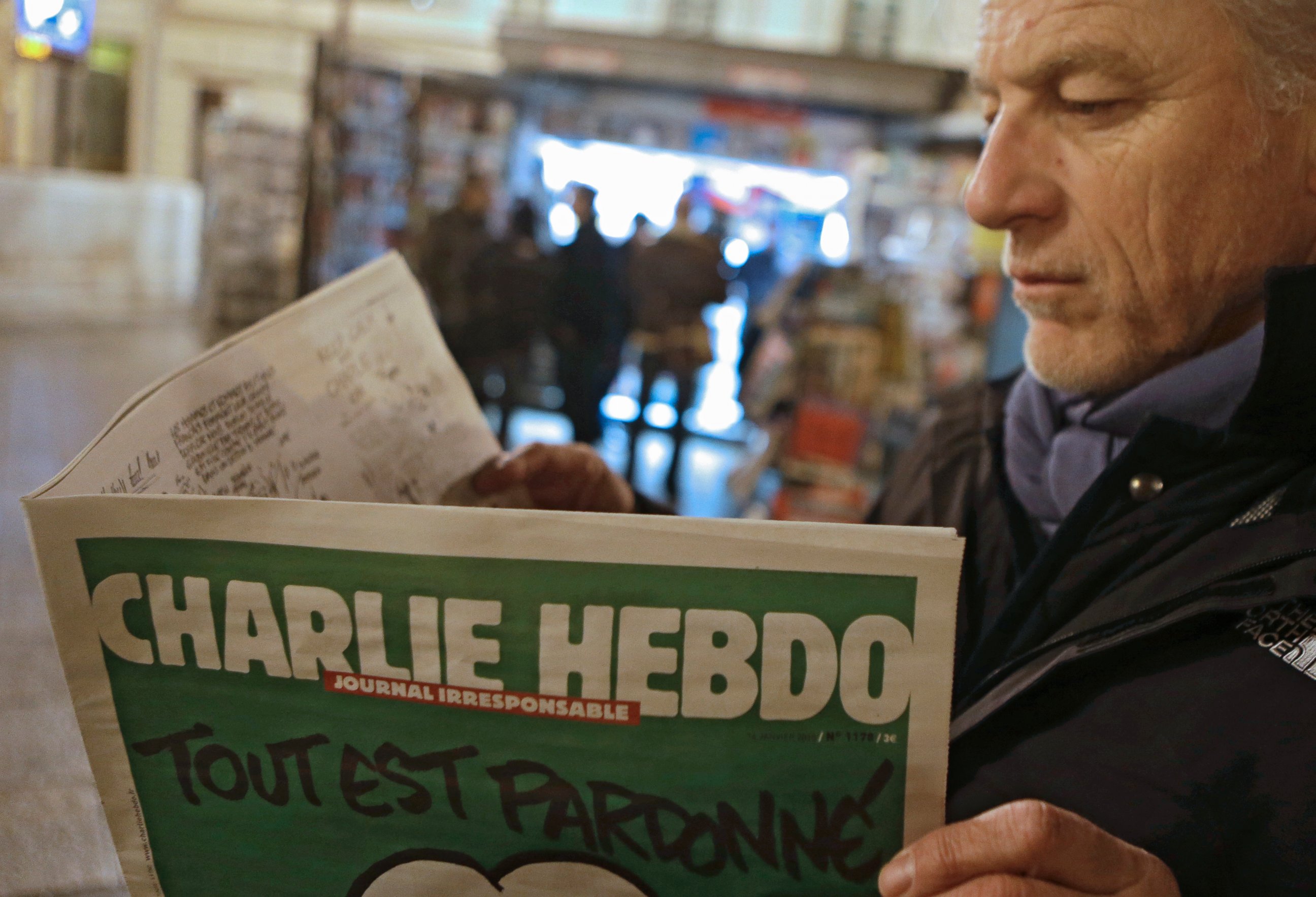 PHOTO: Jean Paul Bierlein reads the latest issue of Charlie Hebdo outside a newsstand in Nice, southeastern France, Jan. 14, 2015.
