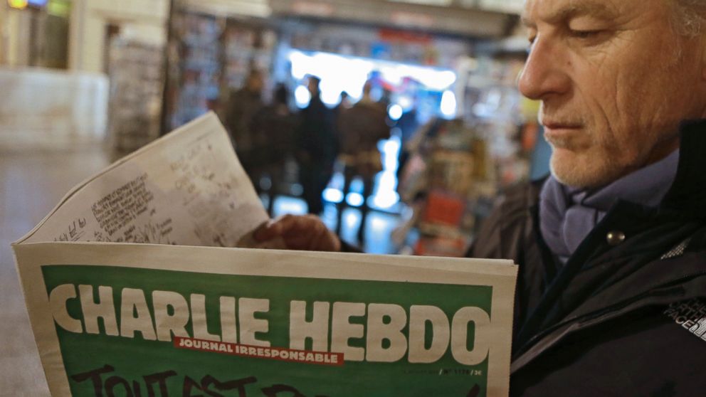 PHOTO: Jean Paul Bierlein reads the latest issue of Charlie Hebdo outside a newsstand in Nice, southeastern France, Jan. 14, 2015.