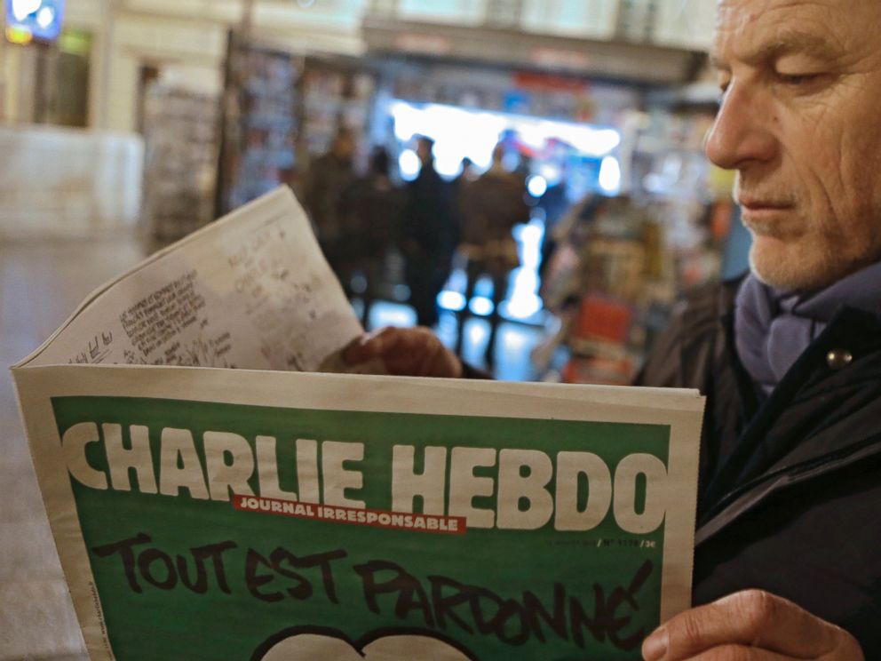 PHOTO: Jean Paul Bierlein reads the latest issue of Charlie Hebdo outside a newsstand in Nice, southeastern France, Jan. 14, 2015.
