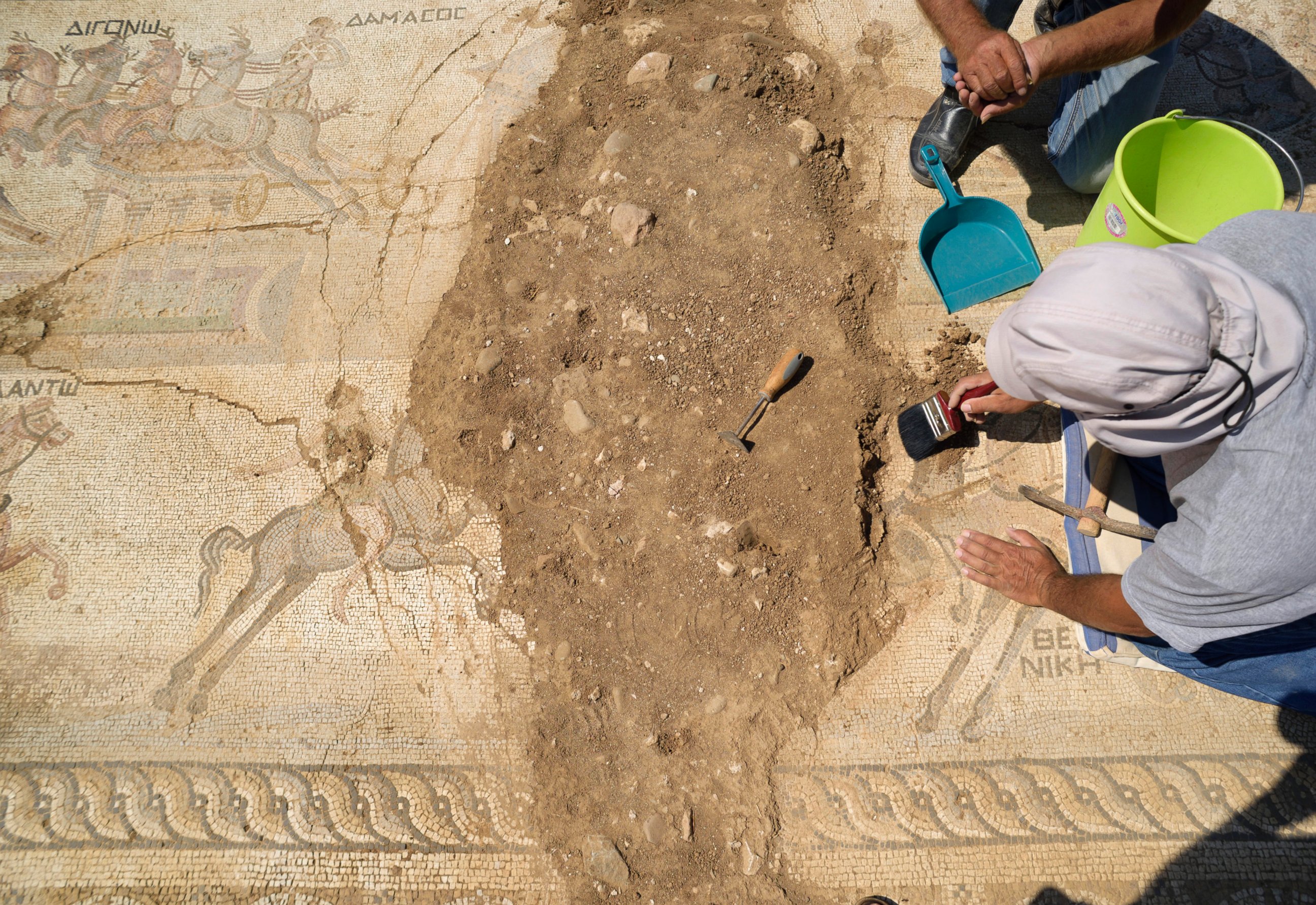PHOTO: Archeologist work on a rare mosaic floor dating to the 4th century depicting scenes from a chariot race in the hippodrome, in Akaki village outside from capital Nicosia, Cyprus, on Aug. 10, 2016. 