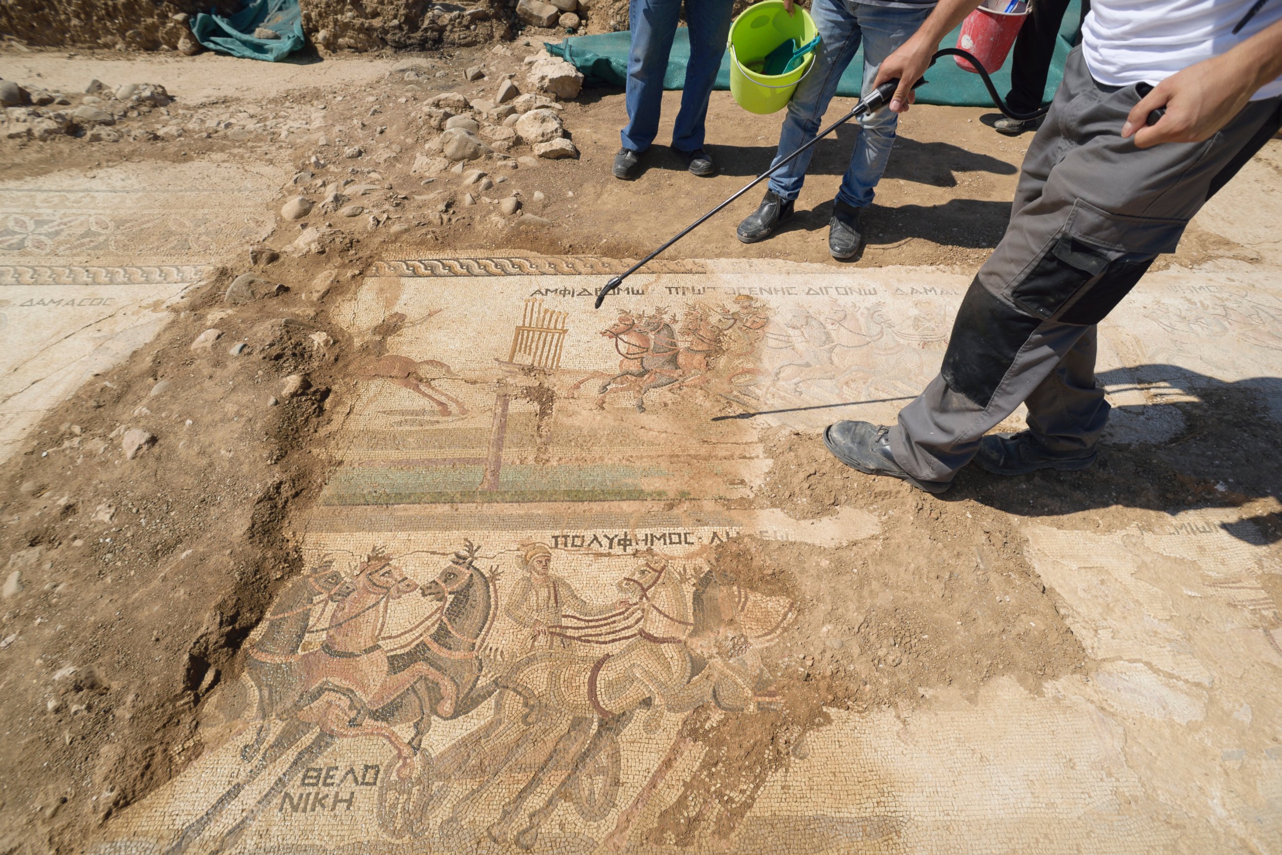 PHOTO: An archeologist sprays water on a rare mosaic floor dating to the 4th century depicting scenes from a chariot race in the hippodrome, in Akaki village outside from capital Nicosia, Cyprus, on Aug. 10, 2016. 