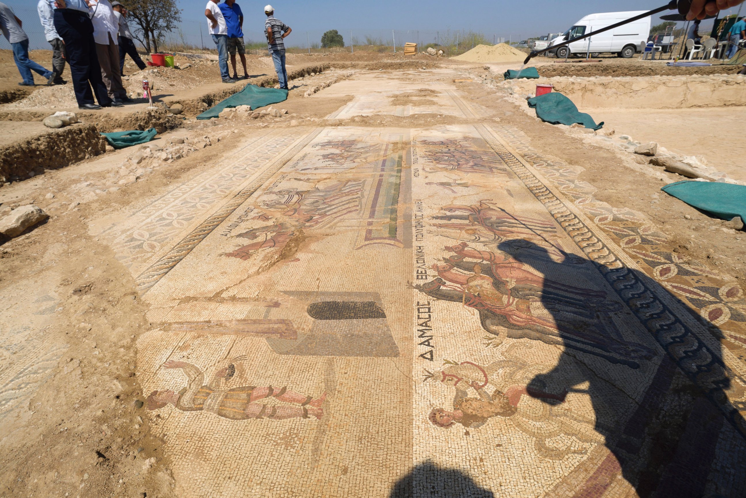 PHOTO: The shadow of Archeologist Fryni Hadjichristofi is cast over a rare mosaic floor dating to the 4th century depicting scenes from a chariot race in the hippodrome, Aug. 10, 2016, in Akaki village outside from capital Nicosia, Cyprus.  