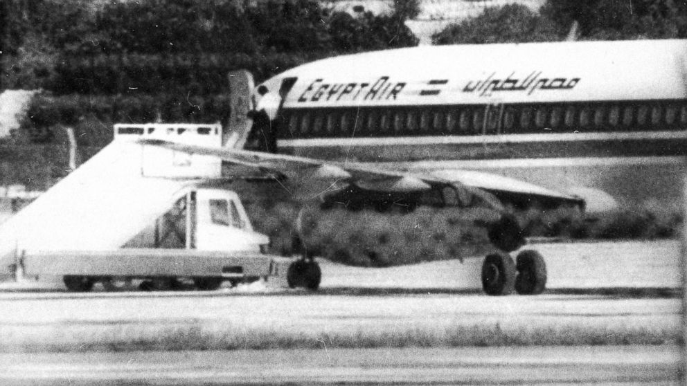 PHOTO: One of the three hijackers of EgyptAir flight 648 appears at the open doorway at Luqa airport in Valletta, Malta, Nov. 24, 1985.