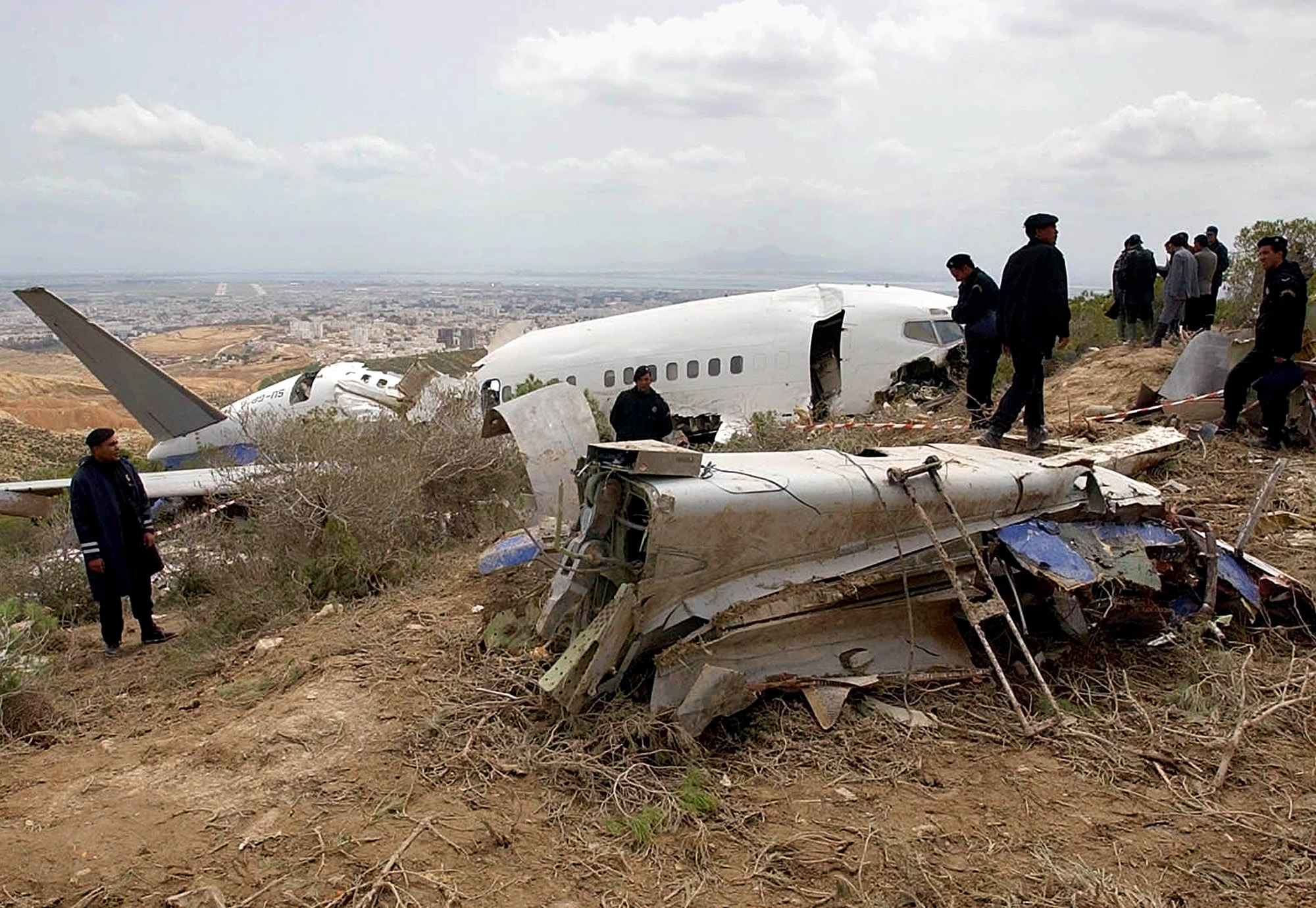 PHOTO:Police guard the debris of an EgyptAir Boeing 737, May 8, 2002, that crashed while trying to land at the Tunis-Carthage airport.  
