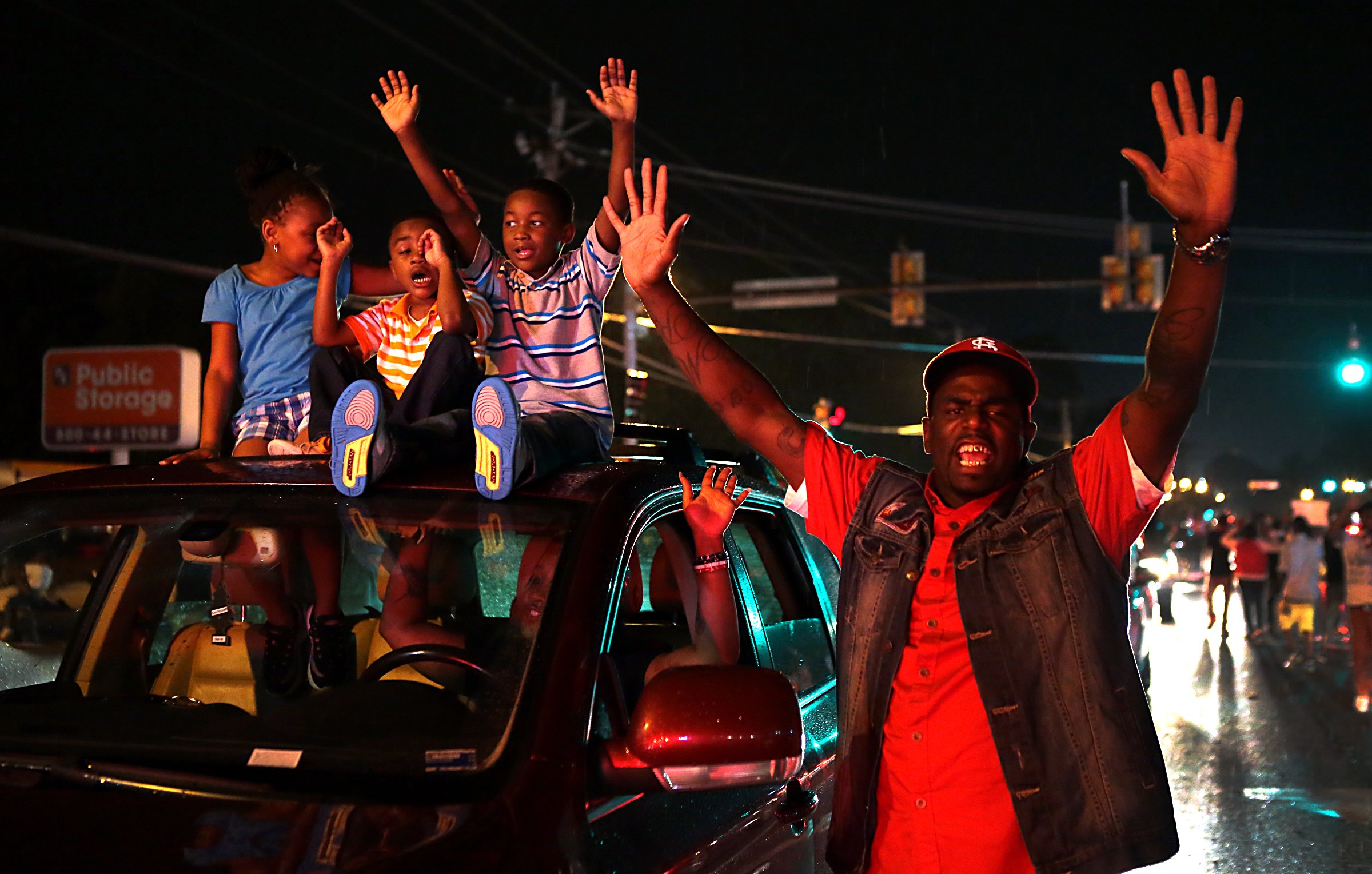 PHOTO: A sea of cars continued to roll down West Florissant Avenue in Ferguson as families protesting the killing of Michael Brown were plentiful on Friday, Aug. 15, 2014.  