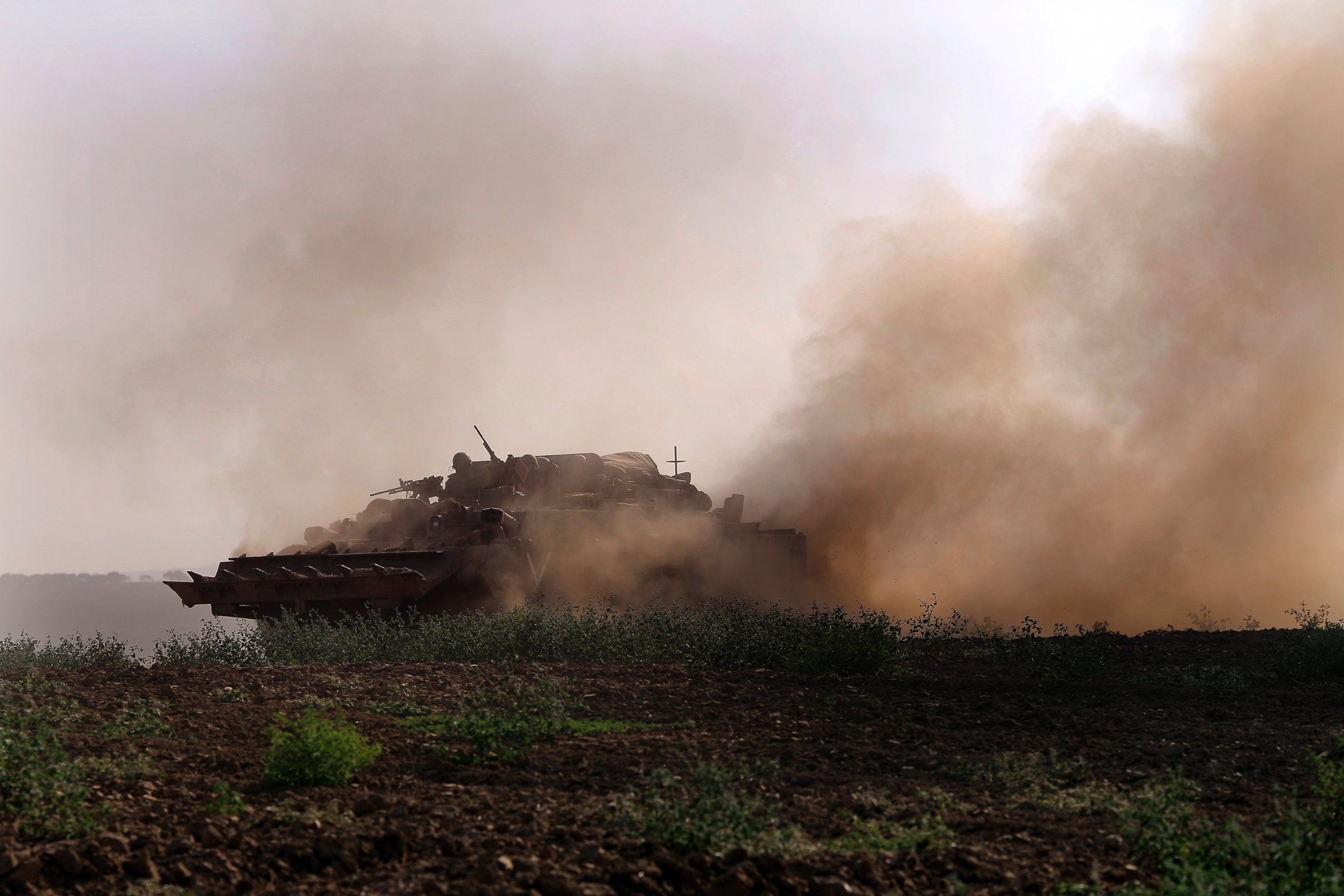 PHOTO: An Israeli tank rides along the border of Israel and the Gaza Strip, July 20, 2014.