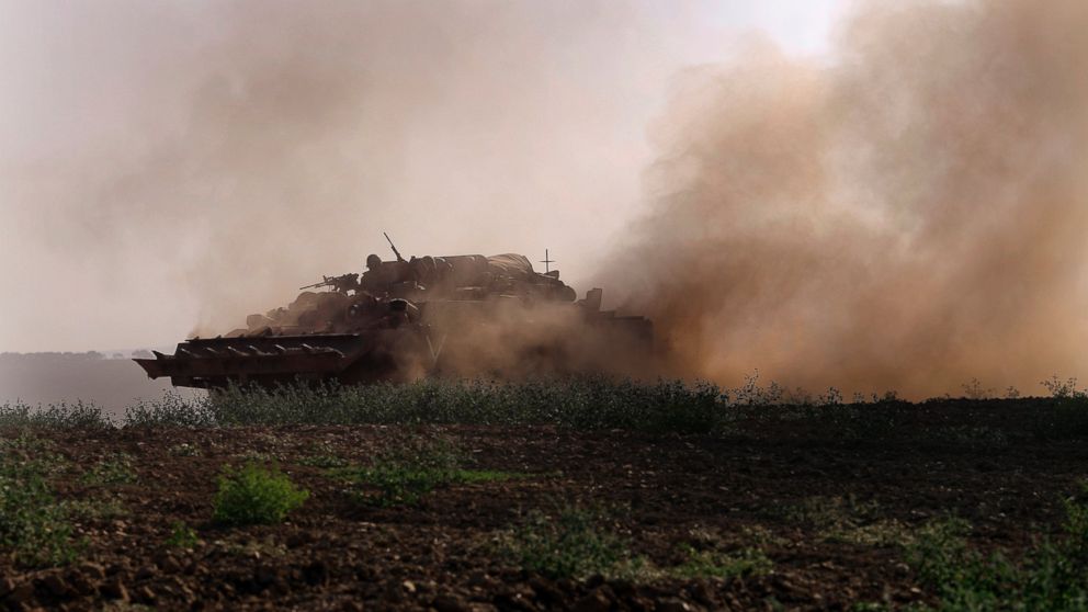 PHOTO: An Israeli tank rides along the border of Israel and the Gaza Strip, July 20, 2014.