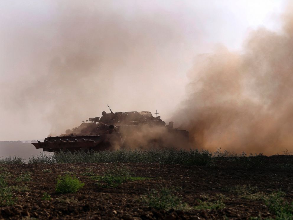 PHOTO: An Israeli tank rides along the border of Israel and the Gaza Strip, July 20, 2014.