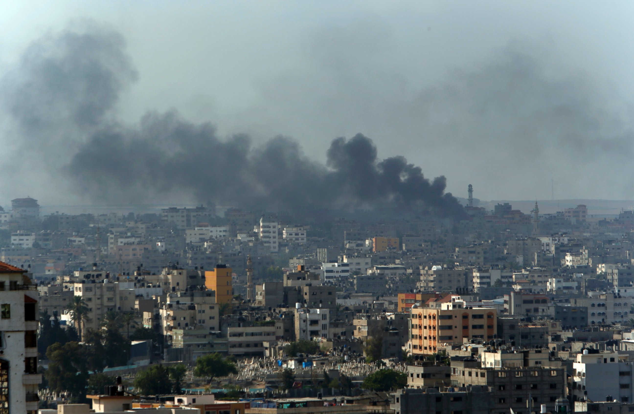 PHOTO: Smoke from Israeli strikes rise over Gaza City, northern Gaza Strip, July 21, 2014.