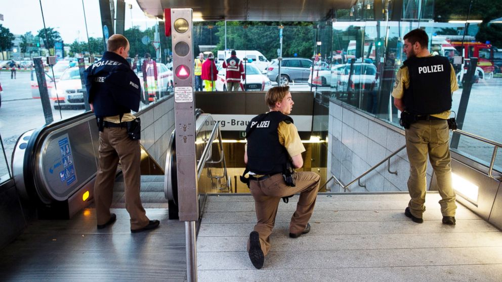 Policemen stand at the underground station Georg-Brauchle-Ring close to the Olympia-Einkaufszentrum shopping centre in which a shooting was reported in Munich, on Friday, July 22, 2016.