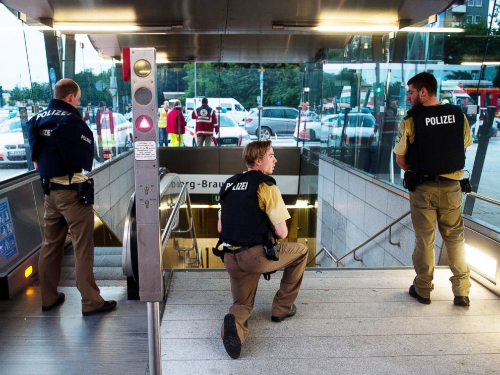 PHOTO: Policemen stand at the underground station Georg-Brauchle-Ring close to the Olympia shopping centre in which a shooting was reported in Munich, on Friday, July 22, 2016. According to media reports police expect several people being killed.