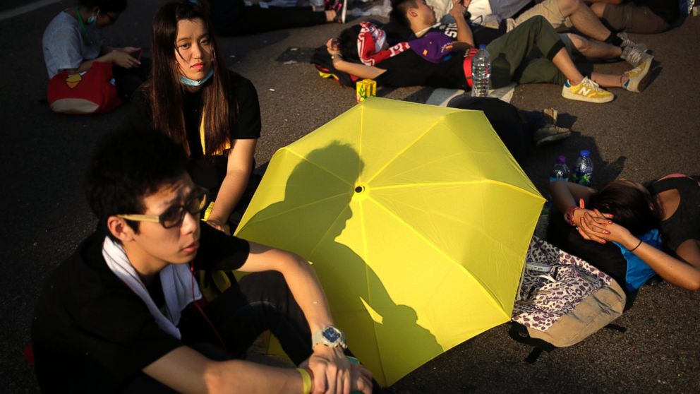 PHOTO: Student activists sleep on a road near the government headquarters where pro-democracy activists have gathered and made camp, Sept. 30, 2014, in Hong Kong.