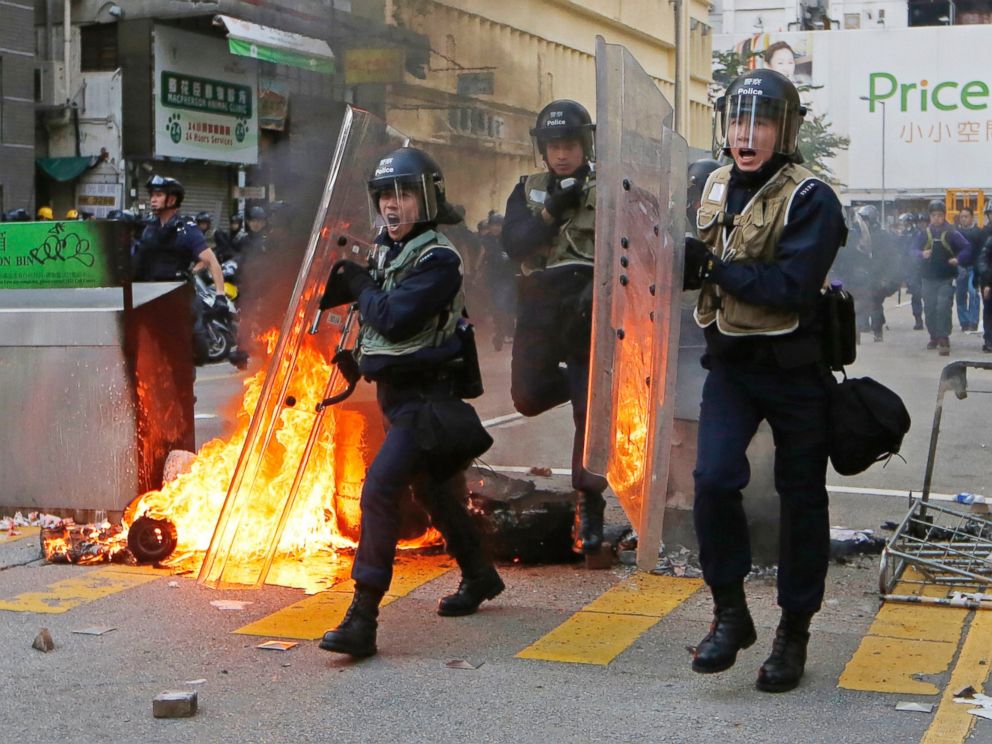 PHOTO: Riot police move forward to the protesters on a street in Mong Kok district of Hong Kong, Feb. 9, 2016.