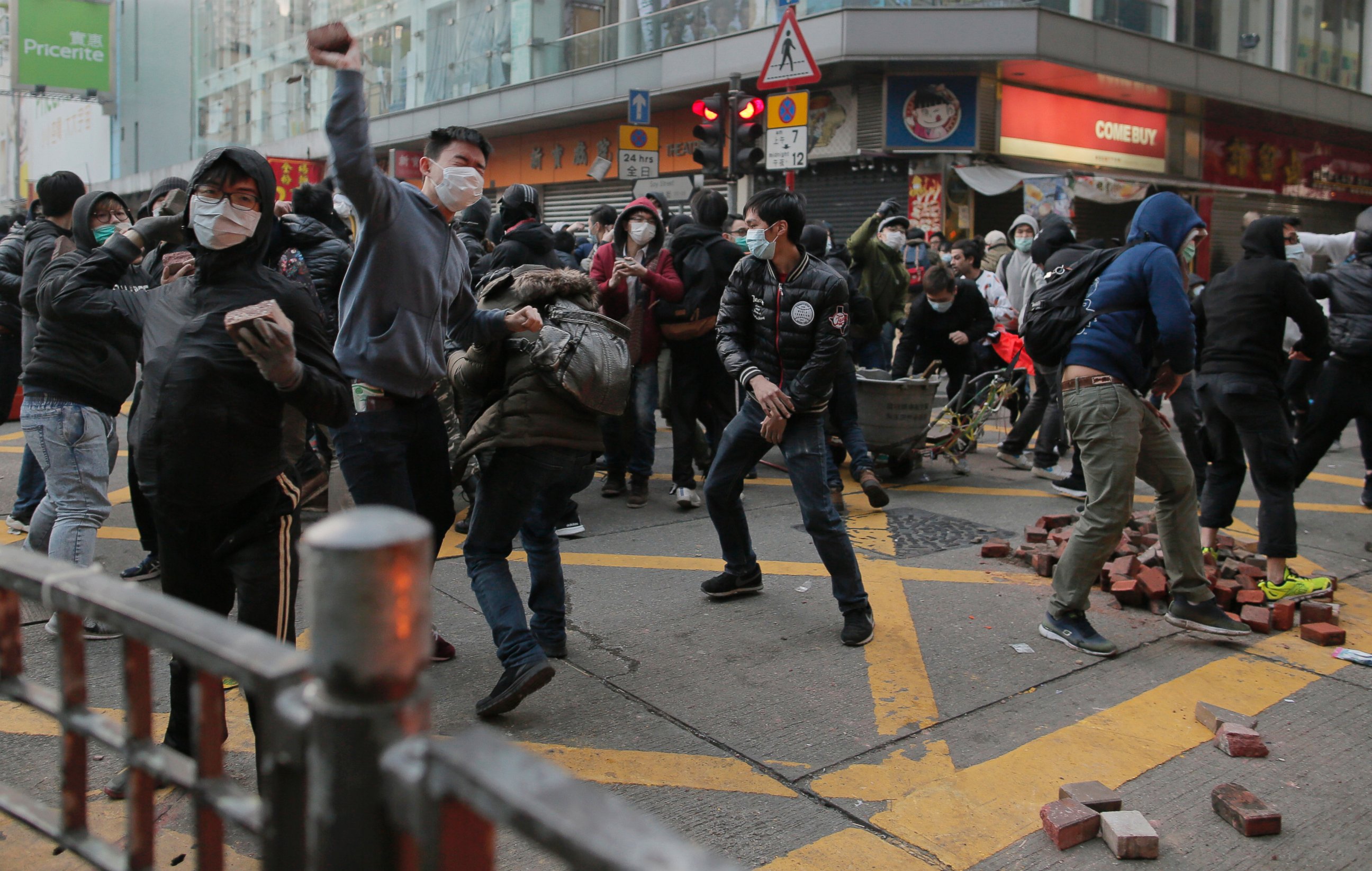 PHOTO: Rioters throw bricks at police in Mong Kok district of Hong Kong, Feb. 9, 2016.